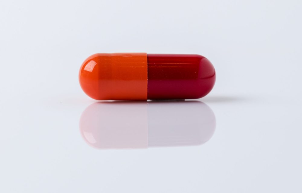 Pill for viral disease on a white background